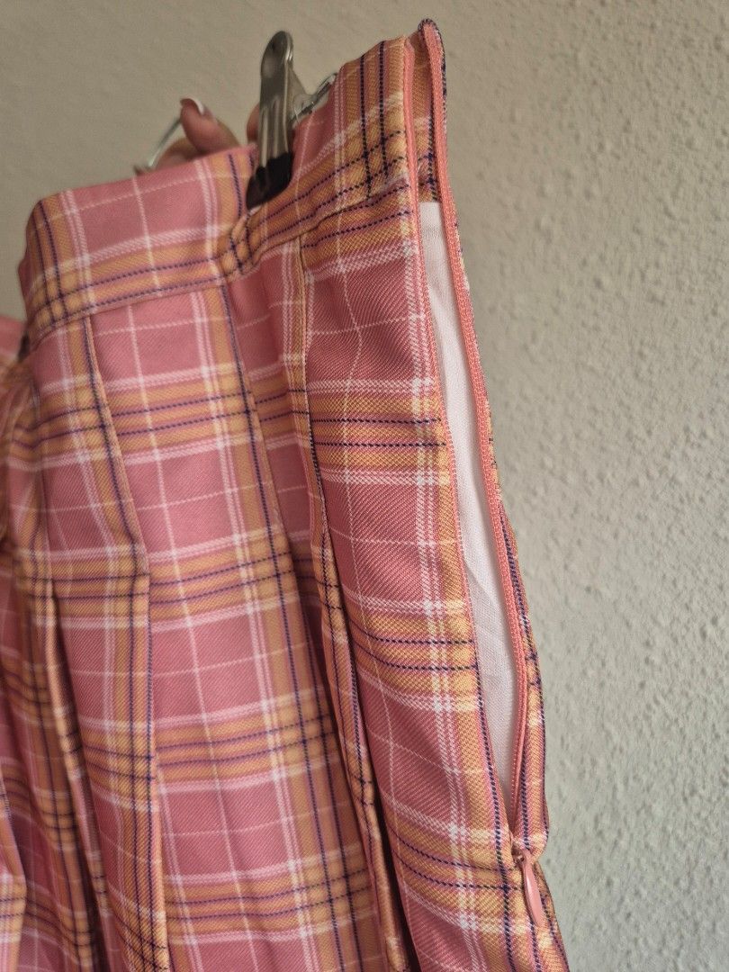 Pink Plaid Pleated Mini skirt (Category: Skirts) located in Manila. Submitted by belovedbyjess (Listing ID 1469972677, Image 3). Description: - Style: Preppy, casual, cute pleated skirt - Pattern & Color: Pink plaid - Fit: High waist with side zipper closure - Comfort: Soft material with built-in white inner lining W18 L 15.