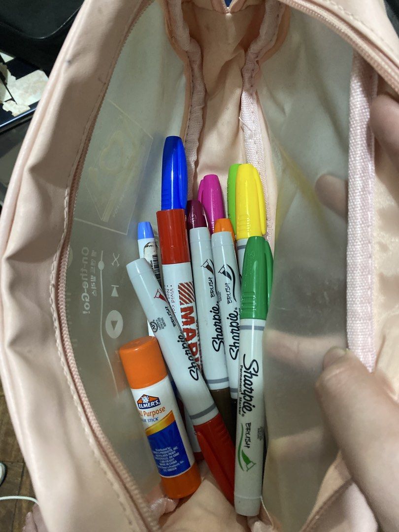Pink Pouch with Markers and Glue Stick (Category: Stationery & School Supplies) located in Manila. Submitted by solonglondon (Listing ID 1470058933, Image 1). Description: - Cute pastel pink zippered pouch - Includes Sharpie brush markers, a red marker, and an Elmer's glue stick - Everything fits neatly inside for easy organization - Ideal for students, journaling, and art projects - Condition: Pre-loved / Good as new - MOP: GCash, BPI - SF via J