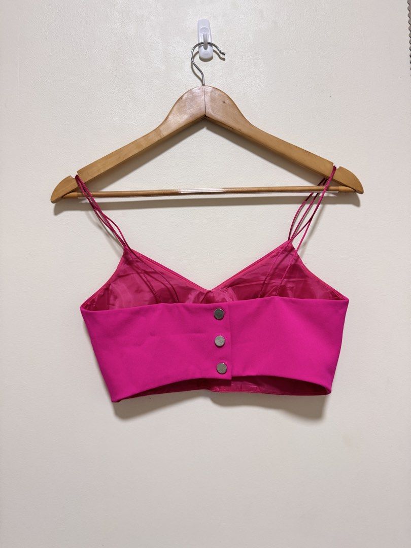 Pink Spaghetti Strap Crop Top (Category: Sleeveless) located in Manila. Submitted by seayouncey (Listing ID 1470069811, Image 2). Description: - Brand: River Island - Color: Vibrant fuchsia / bright pink - Design: Double spaghetti straps, sweetheart neckline, structured cups - Closure: Back button closure with three metallic buttons - Interior: Fully lined - Occasion: Ideal for parties, clubbing, and nights out.