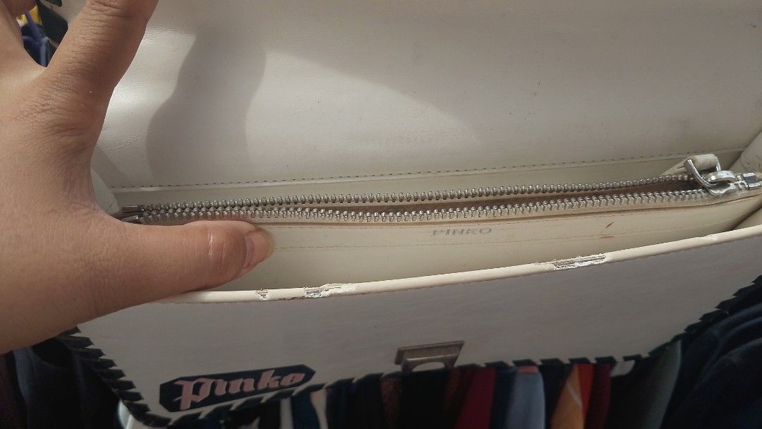 Pinko LOVE Fabulous (model 1P21DD) (Category: Luxury Bags & Wallets) located in Manila. Submitted by jonahq.9 (Listing ID 1470138690, Image 3). Description: Pinko LOVE Fabulous Graffiti Crossbody Bag (Model 1P21DD)! ✨ Iconic Pinko Love Bag – famous swallow‑bird lock, graffiti "Fabulous / Forever Yours" print, black braided trim, silver chain! Preloved AS‑IS: may peeling sa edge, yellowing at signs of use (see pics); zipper looks okay; DM para sa 