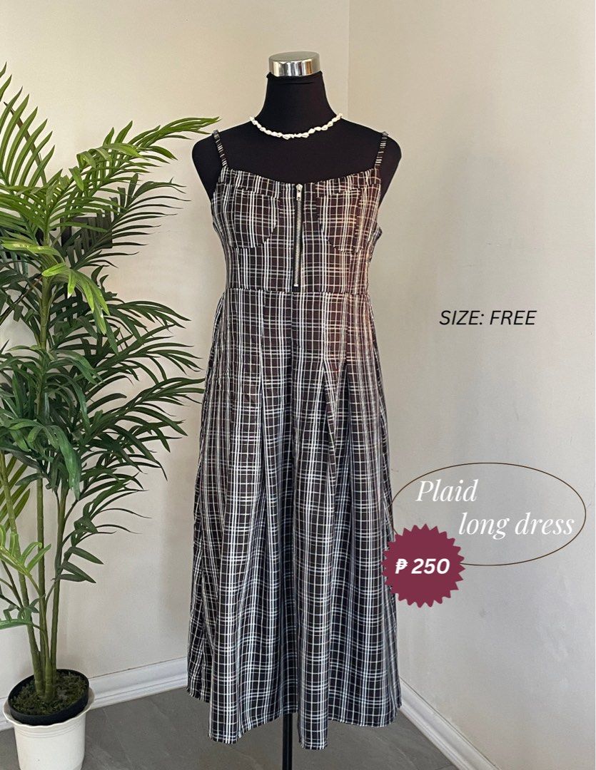 Plaid long dress free size (Category: Dresses) located in Pasig City. Submitted by kbolshoppe.kyla (Listing ID 1470129784, Image 1). Description: - Trendy black and white plaid long dress - Features chic spaghetti straps and a functional front zipper - Flattering pleated skirt section - Free size (fits most body types) - Versatile and comfortable for everyday casual wear.