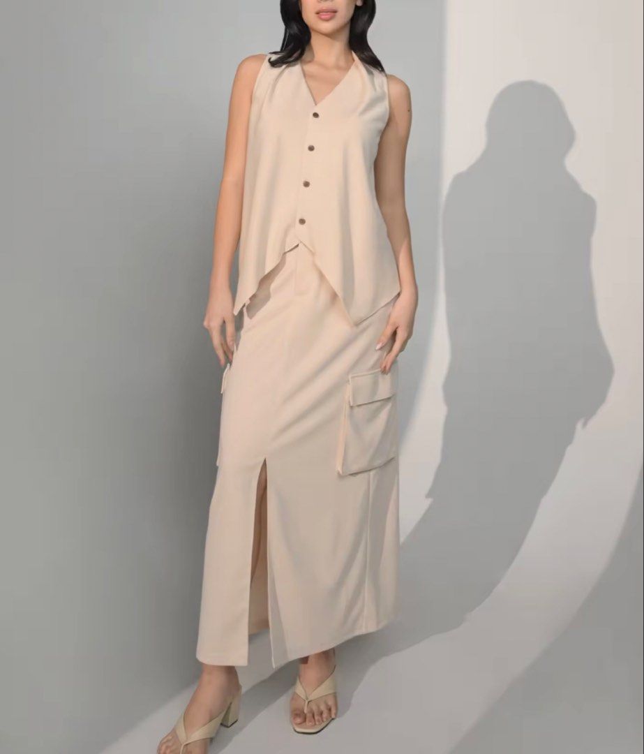 Plains and prints Chandler Maxi Skirt (Category: Sets or Coordinates) located in Marikina City. Submitted by momofthree_ (Listing ID 1470063521, Image 1). Description: -Large size - Light color beige - high-waisted long skirt - Details: Functional utility cargo pockets and a front slit for easy movement - Material: Soft, structured fabric with clean tailoring - Condition: like new used once - Shipping: Fast shipping via J&T Express / Lalamove OK 