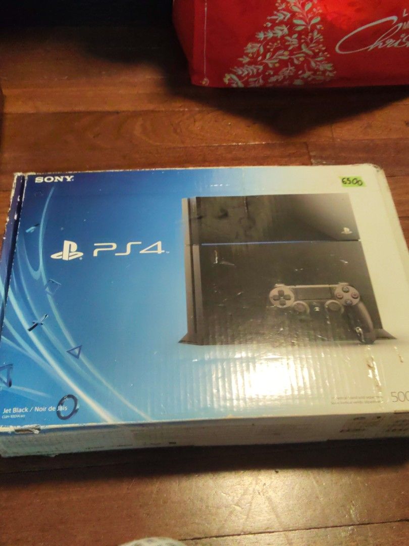PlayStation 4 Console Bundle with Controller and Two Games (Category: PlayStation) located in Caloocan City. Submitted by cooldragon_0358ac (Listing ID 1469953040, Image 1). Description: PlayStation 4 console packed in original box. Includes one black DualShock 4 controller, power cable, and two games. FIFA 14 and Assassin's Creed IV Black Flag included. Everything stored properly in the cardboard insert. Great setup for gaming right away. (Price