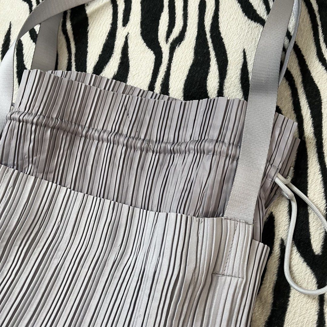 Pleats please drawstring bag (Category: Tote Bags) located in Manila. Submitted by royaldripmanila (Listing ID 1470047368, Image 3). Description: No issue W13 L15.