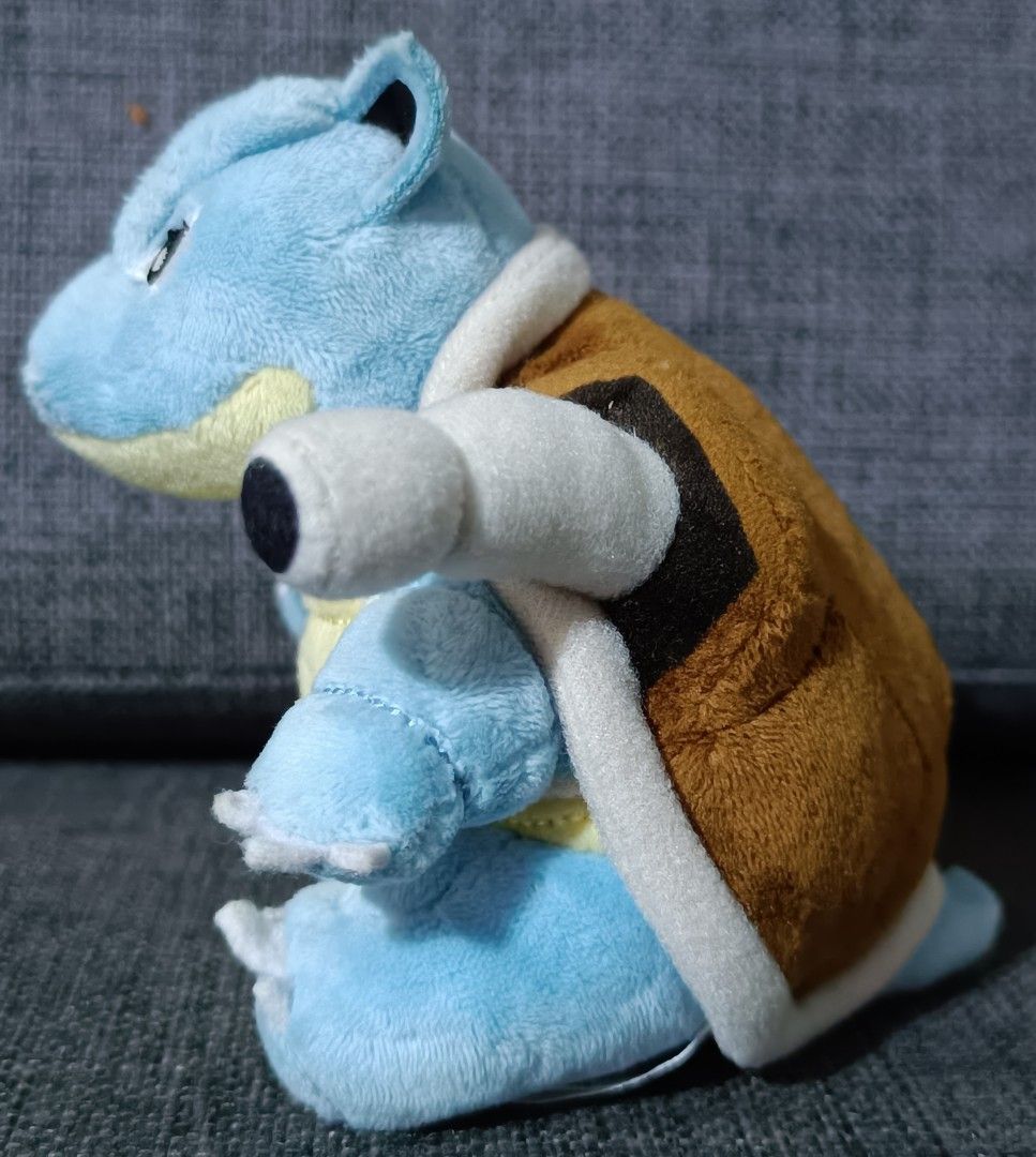 Pokémon Center Pokémon Fit Blastoise Plush (Category: Plushies & Soft Toys) located in San Pedro. Submitted by max__collectibles (Listing ID 1470127668, Image 2). Description: - Authentic Pokémon Center Pokémon Fit Blastoise plush - Size: Approx. 5 inches tall - Details: Features a brown shell, dual shoulder water cannons, and stitched facial features - Tags: Original tush tags attached with 2018 manufacturing date - Condition: Clean, vibrant col