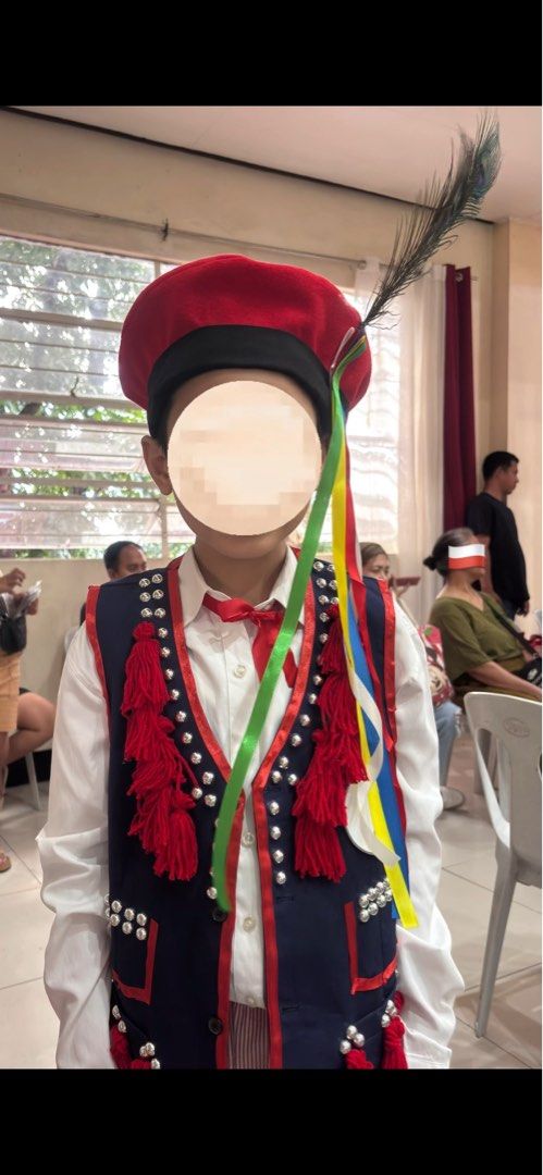POLAND Traditional Costume UN (Category: Babies & Kids Fashion) located in Quezon City. Submitted by thezzzagm (Listing ID 1470117929, Image 3). Description: ✨ UN POLAND COSTUME ✨ - Authentic traditional Polish folk costume for boys - Set includes: dark blue vest with red tassels and metallic bead accents, red and white striped pants, and a decorative hat with colorful ribbons and a peacock feather - Condition: Worn only once, like new - Ideal fo