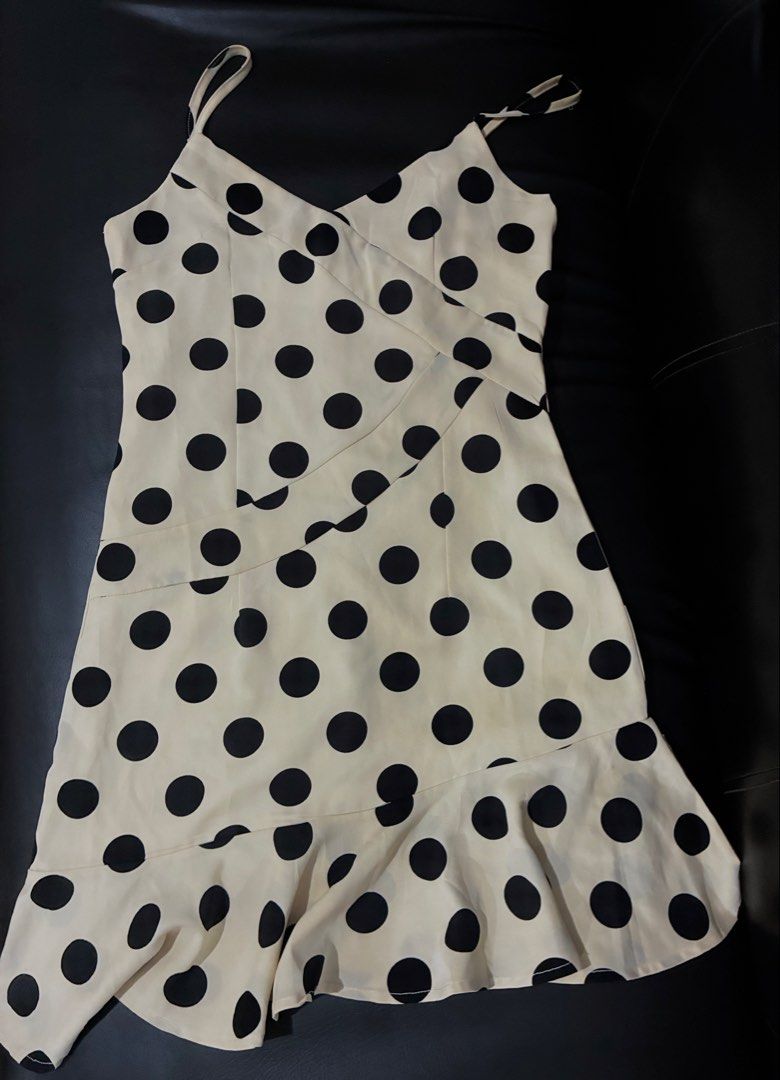 Polka Dot Cami Dress (Category: Dresses) located in Tanauan. Submitted by theitgirlsdibs4 (Listing ID 1470055763, Image 2). Description: - Cream slip dress with cute black polka dots - Flattering V-neckline with adjustable spaghetti straps - Chic wrapped front bodice and fitted waist - Fun, flared uneven ruffled hemline - Convenient hidden back zipper closure - EUC, stylish, and ready to wear!.