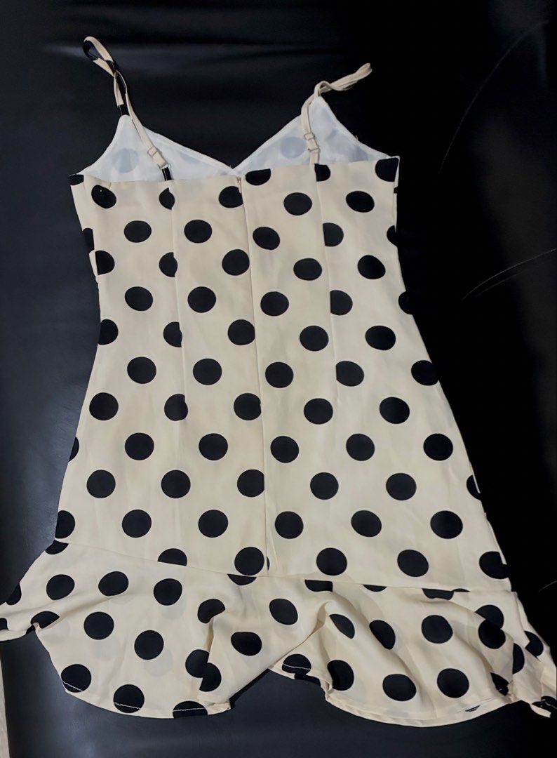 Polka Dot Cami Dress (Category: Dresses) located in Tanauan. Submitted by theitgirlsdibs4 (Listing ID 1470055763, Image 3). Description: - Cream slip dress with cute black polka dots - Flattering V-neckline with adjustable spaghetti straps - Chic wrapped front bodice and fitted waist - Fun, flared uneven ruffled hemline - Convenient hidden back zipper closure - EUC, stylish, and ready to wear!.