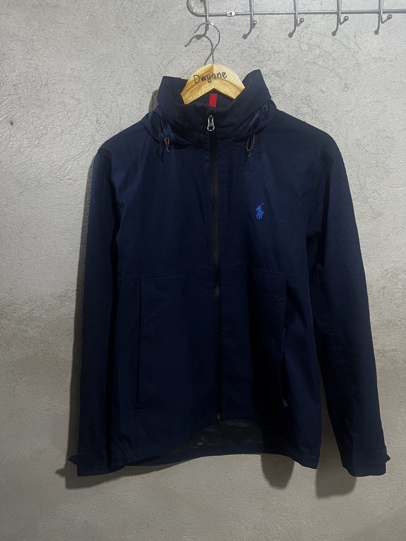 Polo Ralph Lauren Performance Navy Windbreaker Jacket Size S (Category: Coats, Jackets and Outerwear) located in Manila. Submitted by dwyaneallen (Listing ID 1470003555, Image 1). Description: - Brand: Polo Ralph Lauren Performance - Item: Lightweight hooded windbreaker jacket - Color: Solid navy blue - Size: Small (170/92A) - Material: 100% polyester shell - Details: Full zip closure, YKK hardware, hood drawstrings, signature embroidered blue po