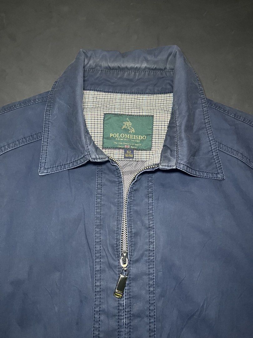 Polomeisdo Navy Blue Zip-Up Jacket Size 52 (Category: Coats, Jackets and Outerwear) located in Muntinlupa City. Submitted by pastforwardthrift (Listing ID 1470123898, Image 3). Description: - Brand/Model: Polomeisdo Navy Blue Zip-Up Jacket - Size: 52 (180/96A) - Regular fit - Design: Classic collar, full front zip with branded metal pull, and front pockets - Details: Chic houndstooth pattern inner lining and adjustable button cuffs - Condition/Us
