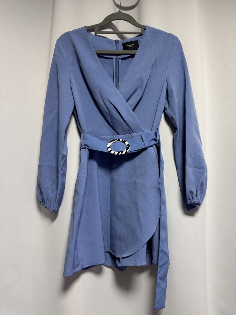 Pomelo Collection Blue Wrap Dress (Category: Dresses) located in Calamba. Submitted by cheriiv (Listing ID 1469950638, Image 2). Description: - Brand: Pomelo Collection - Style: Wrap dress with skort bottom - Color: Cornflower blue - Size: S - Features: Long sleeves with elastic cuffs, V-neckline, hidden back zipper, matching fabric belt with black & white patterned round buckle - Condition: Pre-loved with a small faint stain near the right shoul
