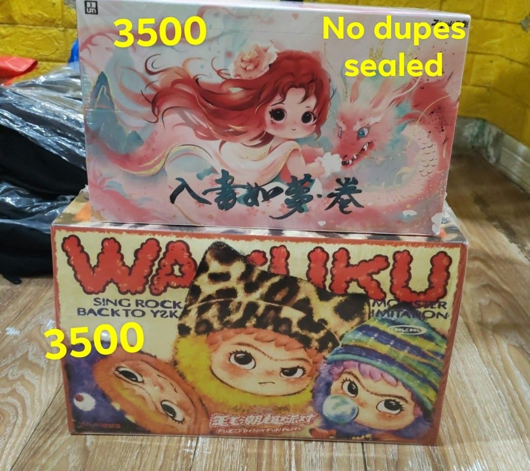 Pop Mart Blind Box Set Sealed No Dupes (Category: Designer & Blind Box Toys) located in Manila. Submitted by sinfulren (Listing ID 1469996613, Image 1). Description: - Price: 3,500 PHP each - Condition: Brand new, factory sealed, and completely unopened - Top Box Design: Anime-style character art with dragon illustration - Bottom Box Design: Fuzzy monster character designs (Wahuku Sing Rock Back To Y2K) - Guarantee: Zero duplicates inside - Quant