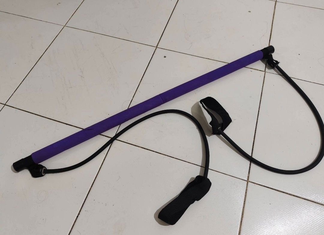 Portable Pilates Bar Kit with Resistance Bands (Category: Toning & Stretching Accessories) located in Bulacan. Submitted by babz30261 (Listing ID 1470102254, Image 1). Description: Purple exercise bar with attached resistance cords and foot loops. Great for home workouts, squats, stretching, and upper body toning. Breaks down into two pieces for easy storage. Lightweight design, super portable..