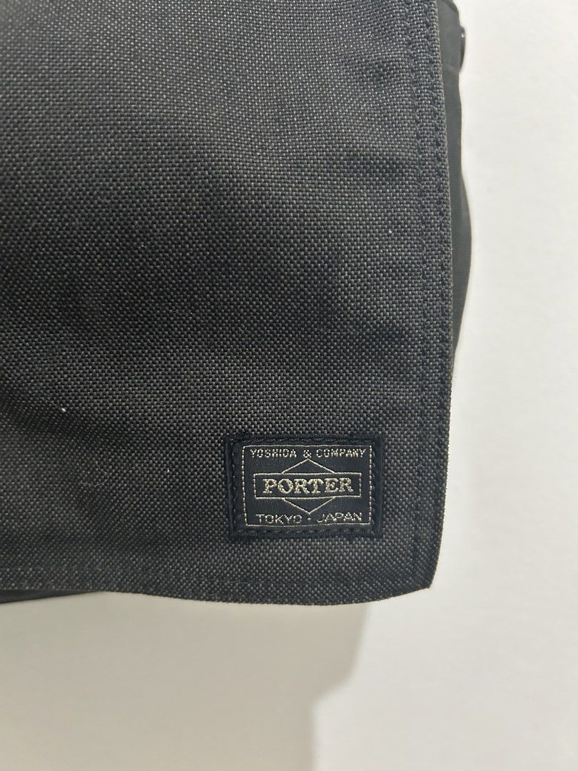 Porter Yoshida & Co. Black Messenger Bag (Category: Sling Bags) located in Angeles City. Submitted by cassey_phoenix (Listing ID 1469966117, Image 2). Description: - Authentic Porter Yoshida & Co. messenger bag from Tokyo, Japan - Crafted from durable black canvas fabric with an adjustable shoulder strap - Secure flap closure with velcro strips and a convenient front zippered pocket - Two open utility pockets located underneath the main flap - Fe
