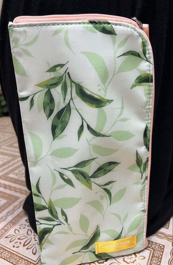 Pouch and scarf set (Category: Purses & Pouches) located in Bacoor. Submitted by ayit. (Listing ID 1470062717, Image 3). Description: Sf inc pouch new scarf once used japan gling personal - Includes: 1 botanical print pouch and 1 patterned scarf - Pouch features: Green leaf pattern, pink zipper, hand strap, L'Occitane brand tag, and soft fluffy white inner lining - Scarf features: Vibrant yellow color with blue and grey rope/chain design - Perfec