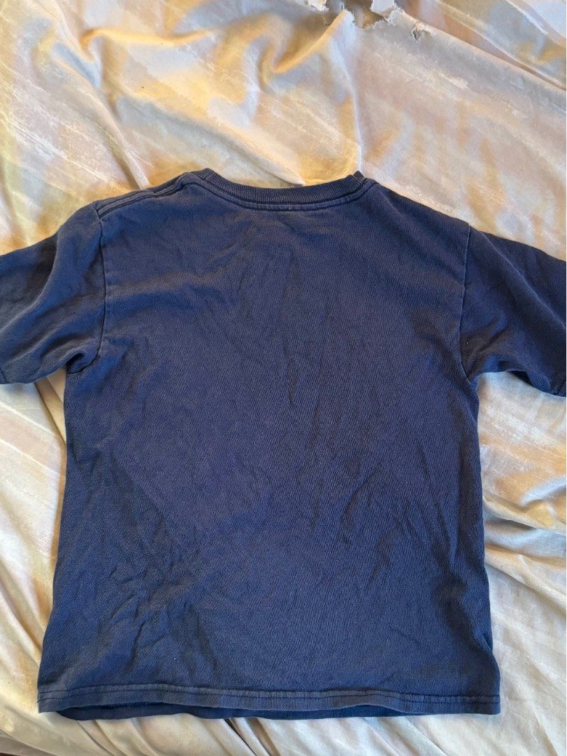 Power Rangers baby tee y2k (Category: Shirts) located in Taguig. Submitted by fillindablank (Listing ID 1470139270, Image 2). Description: - Color: Navy Blue - Design: Power Rangers Dino Charge graphic on front - Size: 5/6 - Material: 100% cotton - Features: Short sleeves, crew neck, made in Honduras - Condition: Shows slight fading and wear on the graphic print from washing.