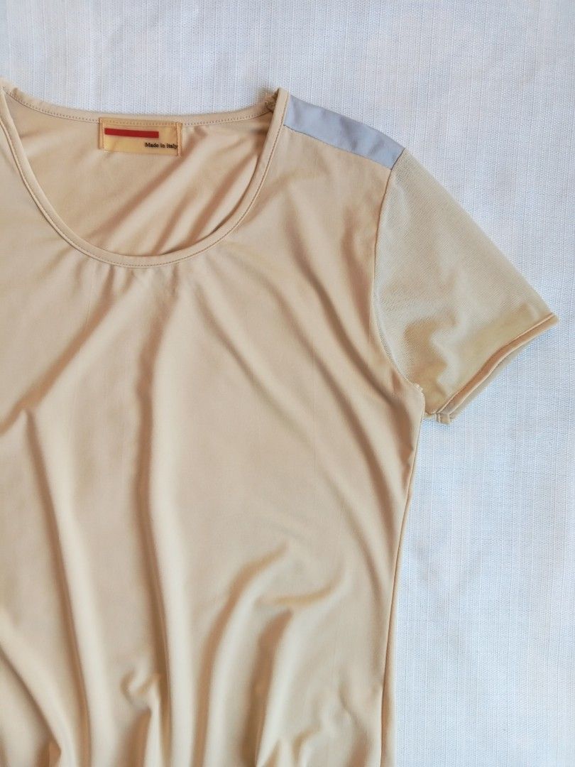 Prada beige short sleeve redtab top (Category: Luxury Apparel) located in Bagabag. Submitted by thrift_stories96 (Listing ID 1470127257, Image 2). Description: Prada beige short sleeve redrab top Medium Length - 22 Width - 17 stretch up to 18 Cloth material - cotton spandex Condition - excellent No flaw.