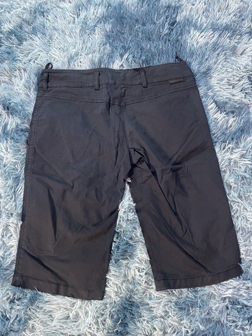 Prada Black Shorts (Category: Shorts) located in Manila. Submitted by jssur (Listing ID 1470084568, Image 3). Description: - Brand: Prada - Color: Classic Black - Style: Casual shorts with clean design - Features: Front pockets, belt loops, and signature red Prada brand label inside waistband - Material: Durable cotton blend.