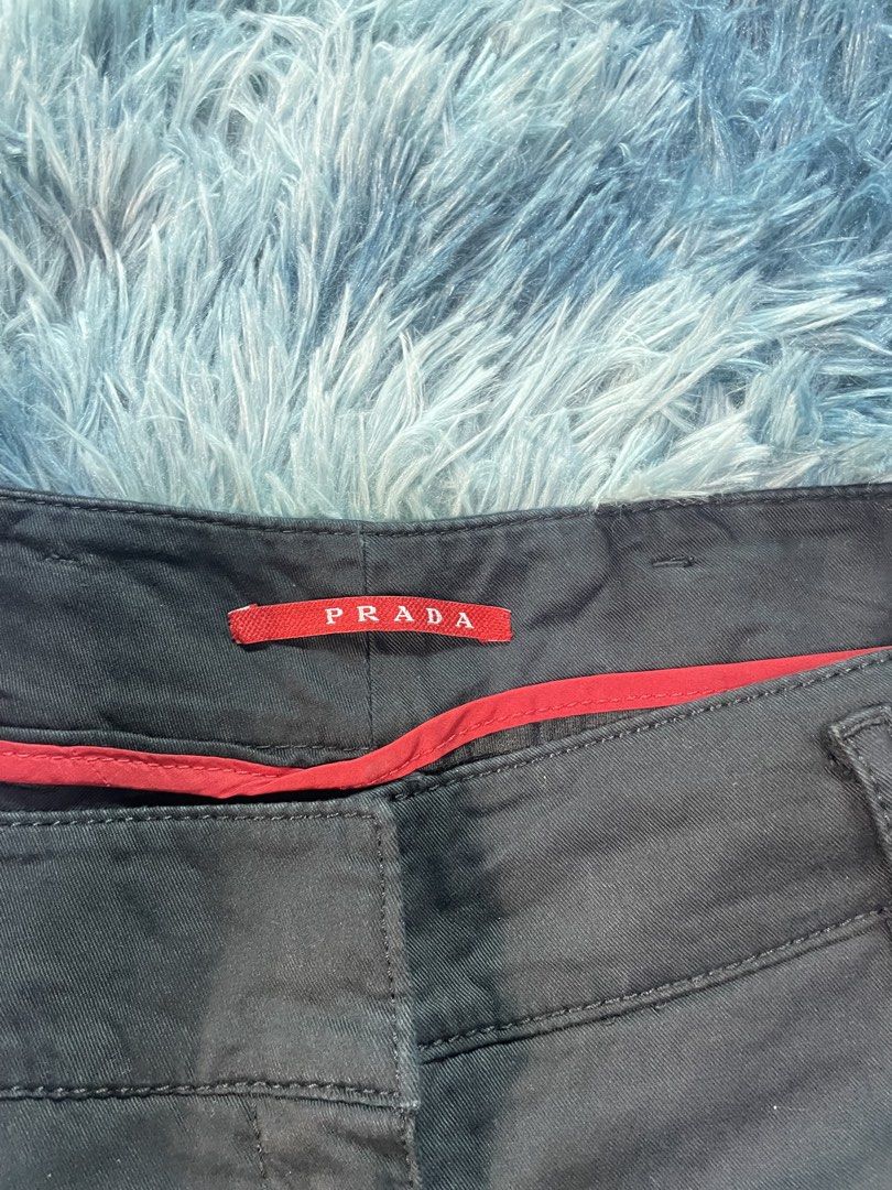 Prada Black Shorts (Category: Shorts) located in Manila. Submitted by jssur (Listing ID 1470084568, Image 2). Description: - Brand: Prada - Color: Classic Black - Style: Casual shorts with clean design - Features: Front pockets, belt loops, and signature red Prada brand label inside waistband - Material: Durable cotton blend.