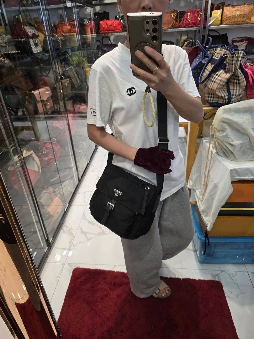 Prada Messenger Bag Authentic💯💯📌 Unisex (Category: Luxury Bags & Wallets) located in Davao. Submitted by SecondhandItems97 (Listing ID 1470021964, Image 2). Description: Small size Includes generic dustbag.