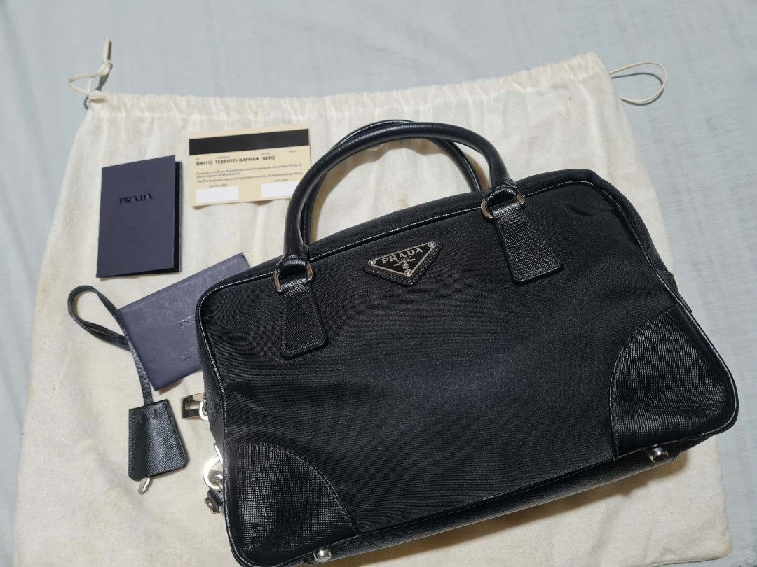 PRADA NYLON SAFFIANO BAUELETTO (Category: Luxury Bags & Wallets) located in Manila. Submitted by lowxuries (Listing ID 1470106036, Image 1). Description: PRADA BAULETTO NYLON SAFFIANO BRAND NEW AUTHENTIC WITH CARDS AND DUST BAG NEVER BEEN USED! 25K.
