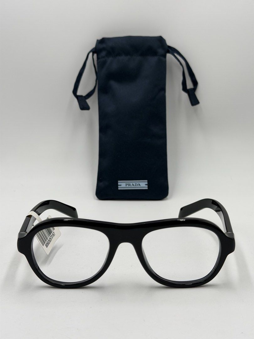 Prada PR C12V (VPRC12) eyeglasses, (Category: Activewear) located in Lipa City. Submitted by _cmluxephilippines (Listing ID 1470017579, Image 2). Description: Prada PR C12V (VPRC12) eyeglasses, • Design: A modern pillow or aviator/pilot-inspired shape that balances sharp structure with fluid, rounded curves. • Material: Crafted entirely from lightweight and durable polished black acetate. • Details: Subtle, elegant Prada logo lettering engraved a