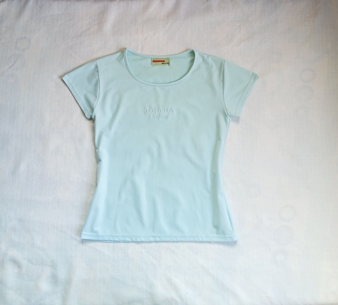 Prada sports light blue embroid mid logo top (Category: Shirts) located in Bagabag. Submitted by thrift_stories96 (Listing ID 1470127809, Image 1). Description: Prada sports light blue embroid mid logo top Medium Length - 22.5 Width - 17.5 stretch up to 18 Cloth material - cotton spandex Condition - 9/10 Flaw - fade yellow stain sa tagilirin malapit sa laylayan..