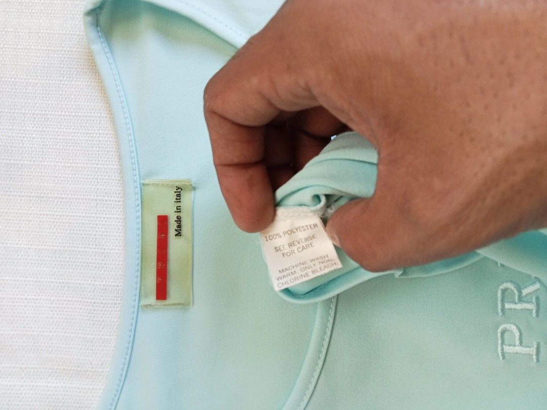 Prada sports light blue embroid mid logo top (Category: Shirts) located in Bagabag. Submitted by thrift_stories96 (Listing ID 1470127809, Image 3). Description: Prada sports light blue embroid mid logo top Medium Length - 22.5 Width - 17.5 stretch up to 18 Cloth material - cotton spandex Condition - 9/10 Flaw - fade yellow stain sa tagilirin malapit sa laylayan..