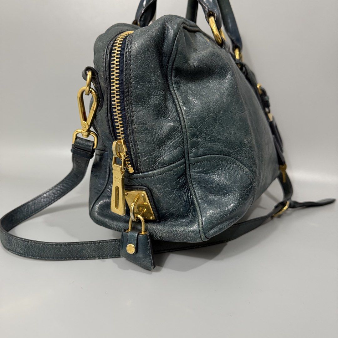 Prada Vitello Handbag w/ Sling (Category: Luxury Bags & Wallets) located in Manila. Submitted by astron_15 (Listing ID 1470004394, Image 3). Description: Authentic prada Color dark teal Rank Ab No issue Complete lock set.