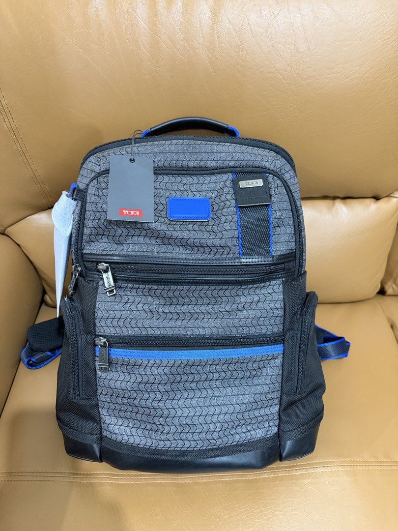 Pre-loved Authentic TUMI Backpack Gray with ultra Blue (Category: Backpacks) located in Quezon City. Submitted by janabl (Listing ID 1470053916, Image 1). Description: - Pre-loved Authentic TUMI Parrish Backpack, in Charcoal Gray with Ultra Blue accents. - Stylish gray patterned fabric with vibrant blue accents and durable leather trim - Multiple front zip compartments for easy organization - Spacious main interior with dedicated organization poc
