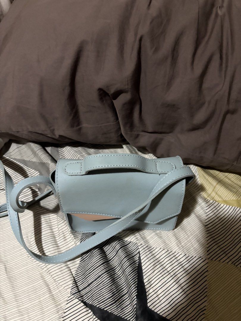 Pre-owned blue crossbody purse (Category: Cross-body Bags) located in Taguig. Submitted by airavyue (Listing ID 1470118524, Image 2). Description: old bag; bought before pandemic but it is very sturdy. no defects, just slightly dirty from dust & can be cleaned with rubbing alcohol (will still be cleaned before shipment).