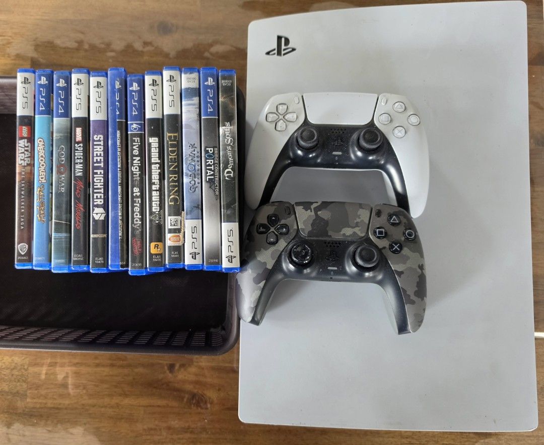 PS5 Fat Disc Edition 825GB + 2 Controllers + 12 Games (Category: PlayStation) located in Quezon City. Submitted by muesli1222 (Listing ID 1469984380, Image 1). Description: 🎮 PS5 Fat Disc Edition 825GB + 2 Controllers + 12 Games 💰 Selling Price: ₱28,000 (Negotiable) Selling my PlayStation 5 Fat Disc Edition (825GB) with 2 DualSense controllers and 12 physical games. ✅ INCLUSIONS: - 1 PS5 Fat Disc Edition – 825GB - 2 DualSense Wireless Controlle