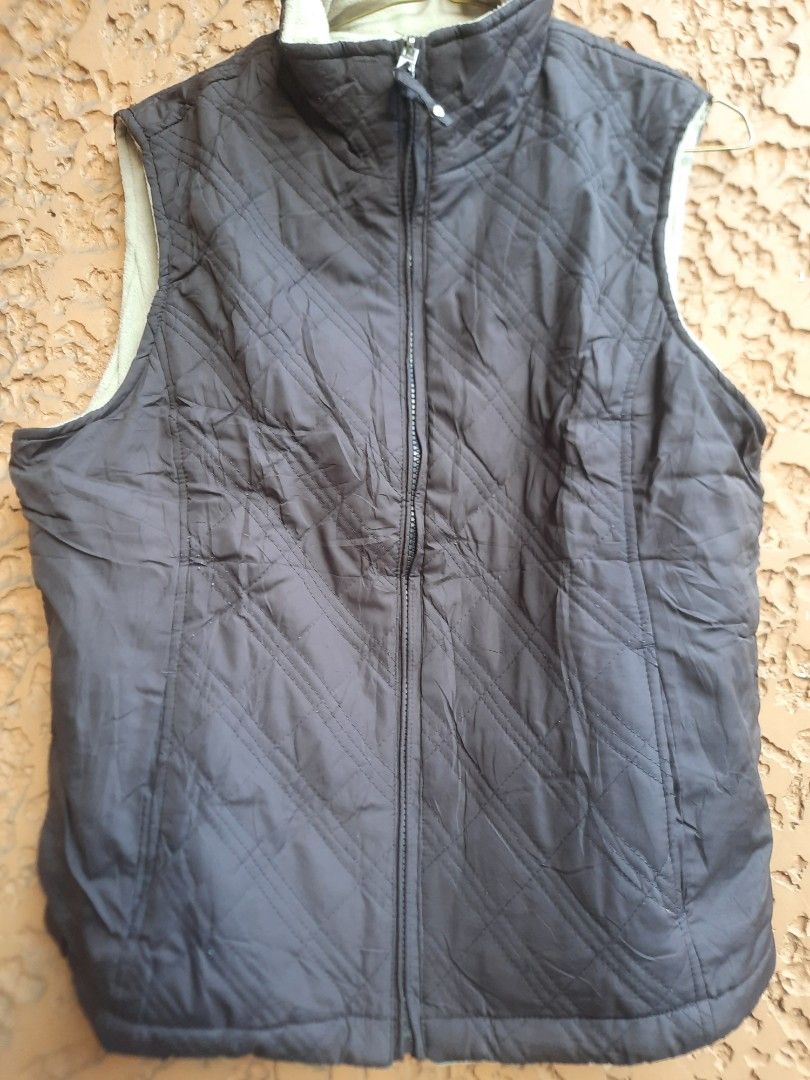 Puffer/vest/sleeveless jacket (Category: Coats, Jackets and Outerwear) located in Quezon City. Submitted by misiamitch (Listing ID 1470054668, Image 1). Description: Dark brown in color (chocolate) in good condition hindi makapal.