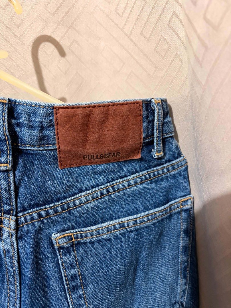 Pull & Bear Blue High Waist Raw Hem Jeans (Category: Jeans) located in Manila. Submitted by janellecas75114 (Listing ID 1470074632, Image 3). Description: - Brand: Pull & Bear - Wash: Classic blue - Size: EUR 34, USA 2, MEX 24 - Fit: High waist with structured waistband and belt loops - Details: Trendy raw frayed ankle hem, standard button/zip fly, and classic 5-pocket setup with contrast stitching - Condition: Clean and well-maintained.