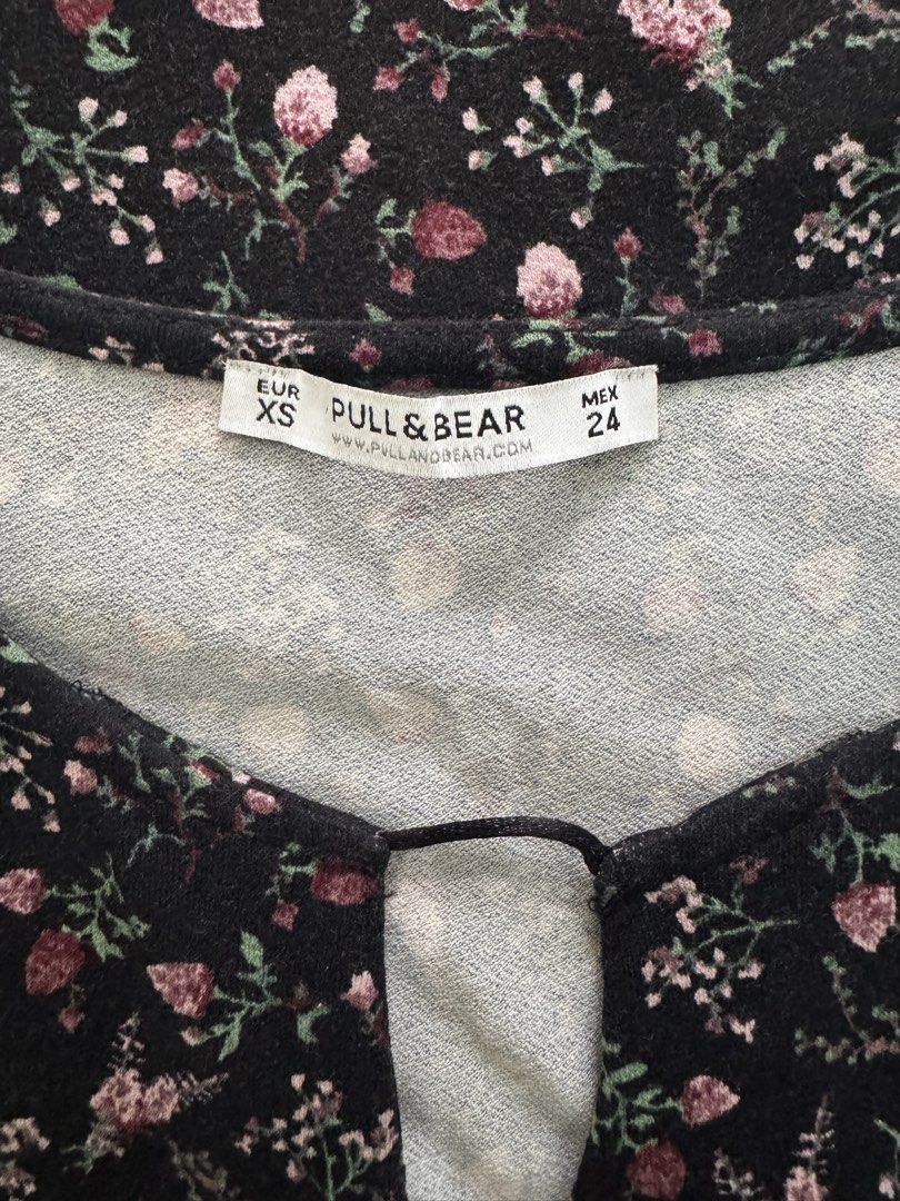 Pull & Bear Floral Black Dress Size XS (Category: Dresses) located in Dagupan City. Submitted by truehawk.c51029 (Listing ID 1470090793, Image 2). Description: - Brand: Pull & Bear - Size: XS - Color/Pattern: Black with pink and green floral print - Material: 95% viscose, 5% elastane (super soft and stretchy) - Features: Three-quarter sleeves, keyhole neckline cutout - Condition/Style: Great everyday piece, easy to throw on and style.