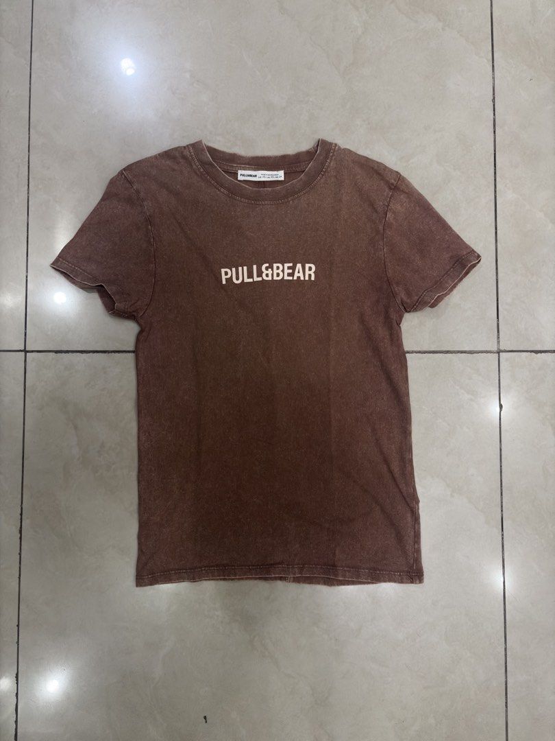 Pull and Bear Brown T-Shirt (Category: Shirts) located in Manila. Submitted by chrsinyourarea (Listing ID 1470053303, Image 1). Description: Brand: Pull&Bear Size: EUR XS / USA XS / MEX 24 Color/Style: Brown acid wash with vintage faded look Condition: Used once. Kept in storage. .