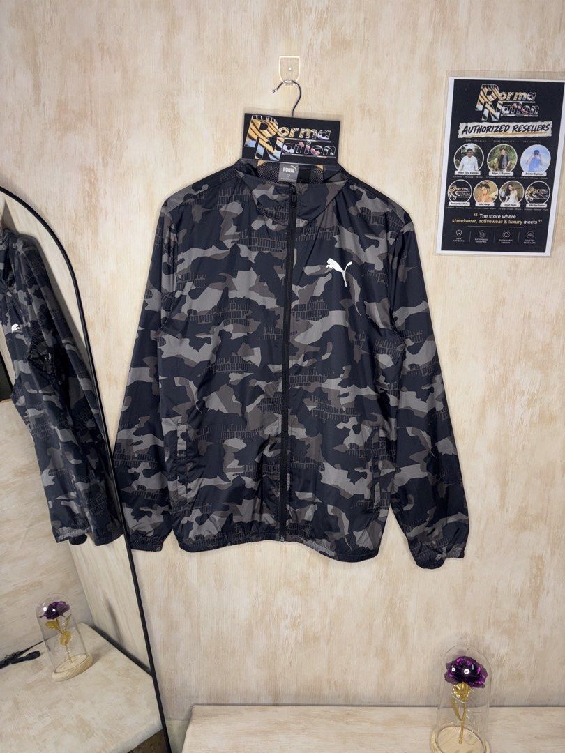 PUMA ESSENTIALS PRINTED CAMOU WINDBREAKER JACKET (Category: Coats, Jackets and Outerwear) located in Cabuyao City. Submitted by pormanation-thrift-store (Listing ID 1469991343, Image 1). Description: PUMA ESSENTIALS PRINTED CAMOU WINDBREAKER JACKET Condition: LIKE NEW Color rate: 10/10 (PWEDE SA MASELAN) Size: MEDIUM Dimes: 22”Wx27”L Issue: NONE‼️ Price: 1500.