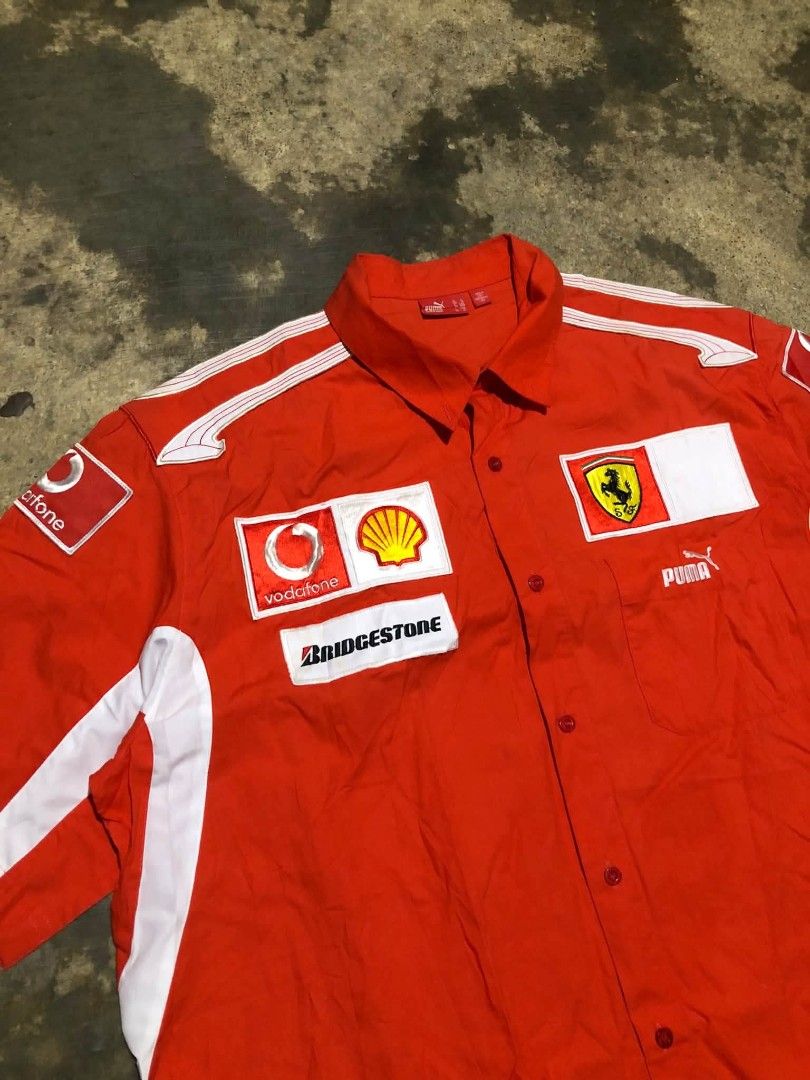 Puma Ferrari F1 (Category: Tshirts & Polo Shirts ) located in Manila. Submitted by lumang__gamit00 (Listing ID 1470068984, Image 2). Description: This is a vintage 2005–2006 Puma x Scuderia Ferrari Formula 1 Pit Crew / Team Button-Up Shirt featuring sponsor branding like Vodafone, Shell, and Bridgestone Width: 25 Length: 31 Excellent Condition no issue.
