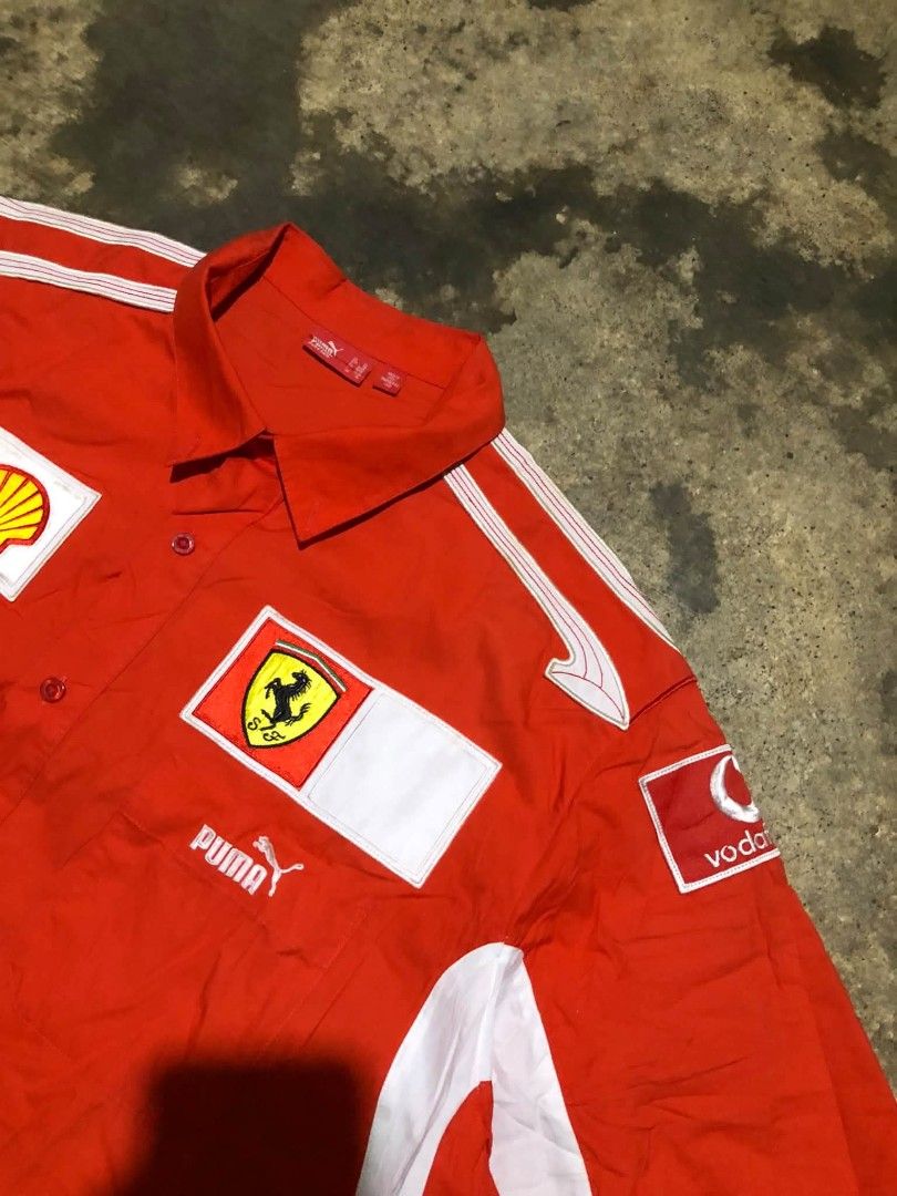 Puma Ferrari F1 (Category: Tshirts & Polo Shirts ) located in Manila. Submitted by lumang__gamit00 (Listing ID 1470068984, Image 3). Description: This is a vintage 2005–2006 Puma x Scuderia Ferrari Formula 1 Pit Crew / Team Button-Up Shirt featuring sponsor branding like Vodafone, Shell, and Bridgestone Width: 25 Length: 31 Excellent Condition no issue.