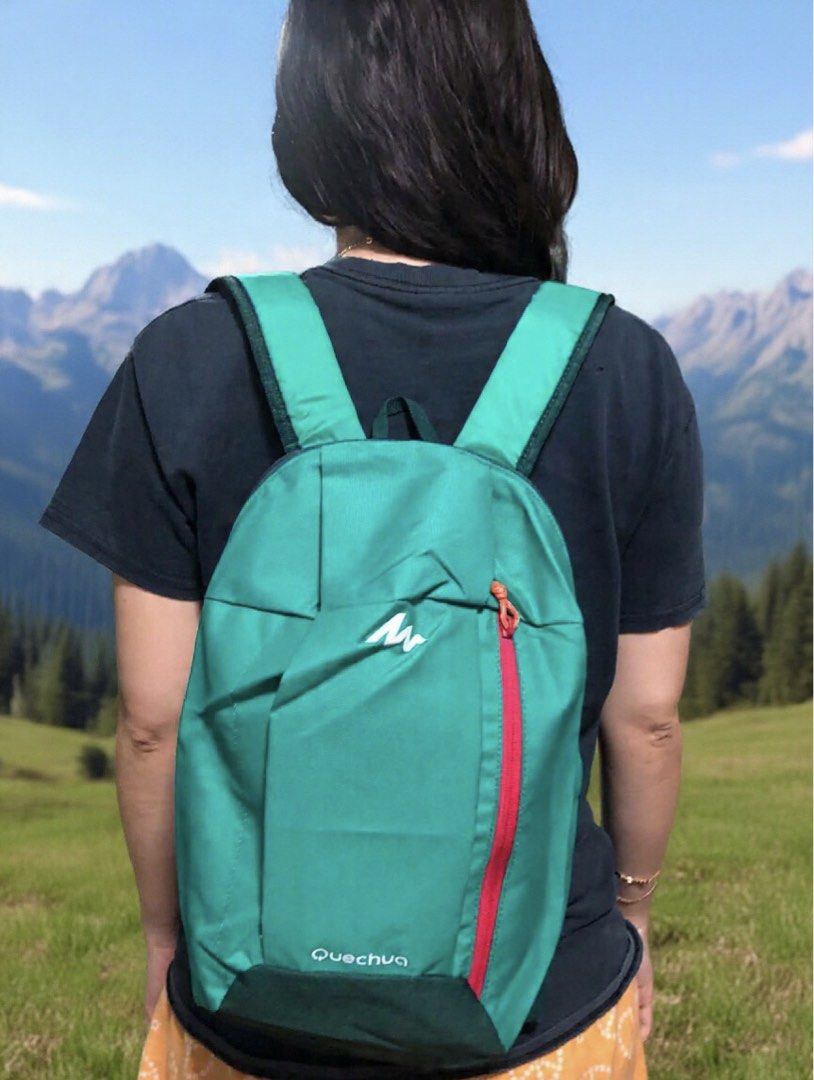 Quechua Green Backpack Daypack (Category: Backpacks) located in Manila. Submitted by blesslala (Listing ID 1470050781, Image 3). Description: - Brand: Quechua - Color: Green with dark green accents and a bright pink vertical front zipper pocket - Features: Adjustable green shoulder - Dimension :39 cm x 22 cm x 8 cm.
