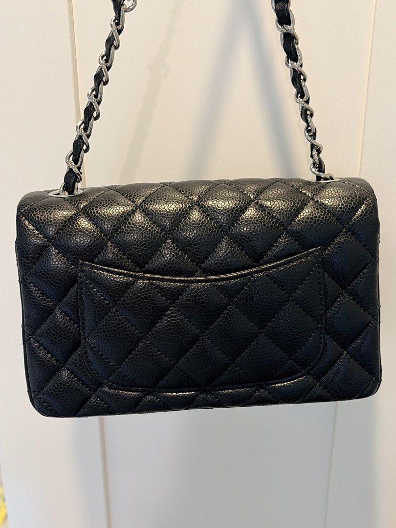 Quilted Black Leather Flap Bag (Category: Luxury Bags & Wallets) located in Manila. Submitted by rd_sell (Listing ID 1470028946, Image 3). Description: - No brand - Material: Quilted Caviar Leather - Color: Classic Black - Hardware: Silver-tone with signature turn-lock closure - Strap: Interwoven chain shoulder strap - Features: Structured shape, diamond quilting pattern, and convenient rear slip pocket - Inclusion: Original black fabric dust bag