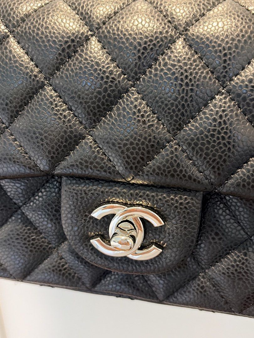 Quilted Black Leather Flap Bag (Category: Luxury Bags & Wallets) located in Manila. Submitted by rd_sell (Listing ID 1470028946, Image 2). Description: - No brand - Material: Quilted Caviar Leather - Color: Classic Black - Hardware: Silver-tone with signature turn-lock closure - Strap: Interwoven chain shoulder strap - Features: Structured shape, diamond quilting pattern, and convenient rear slip pocket - Inclusion: Original black fabric dust bag