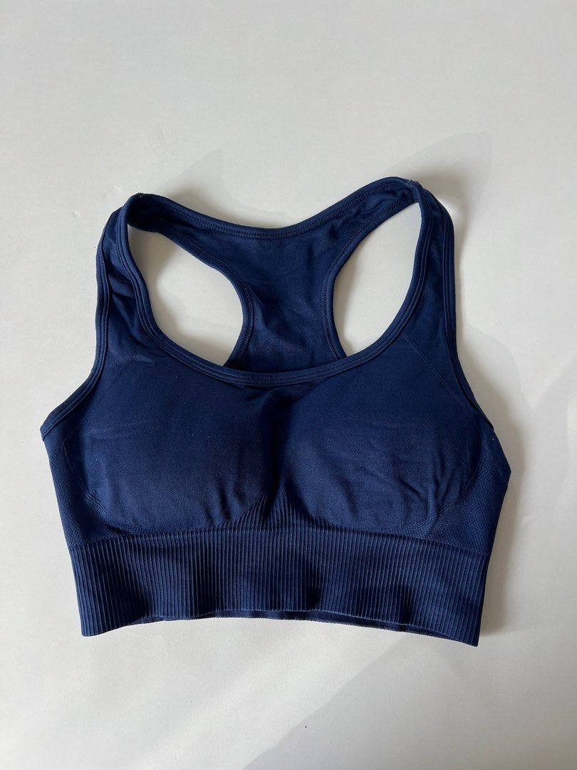 Racerback Sports Bra (Category: Activewear) located in Santiago. Submitted by riceavllnz (Listing ID 1469957708, Image 1). Description: Classic navy blue sports bra with a flattering racerback design, wide ribbed waistband, and breathable mesh-style side panels. * Brand: Unbranded * Color: Navy blue * Style: Racerback * Features: Wide ribbed underband, breathable side panels, and removable-looking cup padding * Material: Stretchy performance-styl