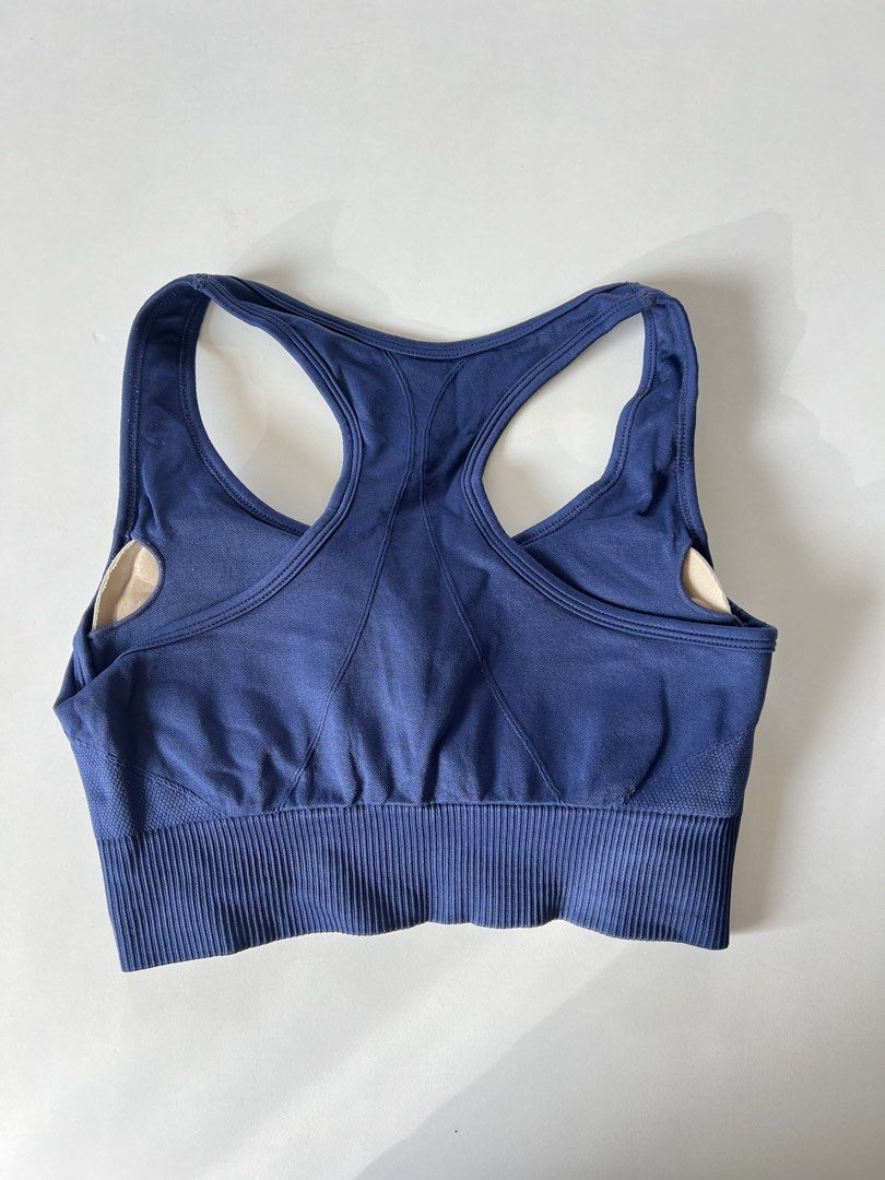 Racerback Sports Bra (Category: Activewear) located in Santiago. Submitted by riceavllnz (Listing ID 1469957708, Image 2). Description: Classic navy blue sports bra with a flattering racerback design, wide ribbed waistband, and breathable mesh-style side panels. * Brand: Unbranded * Color: Navy blue * Style: Racerback * Features: Wide ribbed underband, breathable side panels, and removable-looking cup padding * Material: Stretchy performance-styl