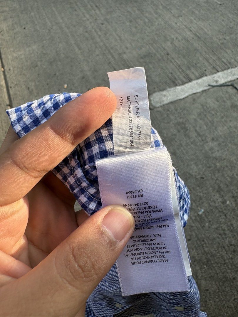 Ralph Lauren Blue Gingham Short Sleeve Button-Down Shirt (Category: Tshirts & Polo Shirts ) located in Iligan City. Submitted by seddicmoti2002 (Listing ID 1470138910, Image 3). Description: Ralph Lauren button-down shirt in blue and white gingham check pattern. Short sleeves, classic collar, and front button closure. Small embroidered pony logo on the left chest. Tag reads size L (14-16) with natural stretch fabric. 100 percent cotton, made in V