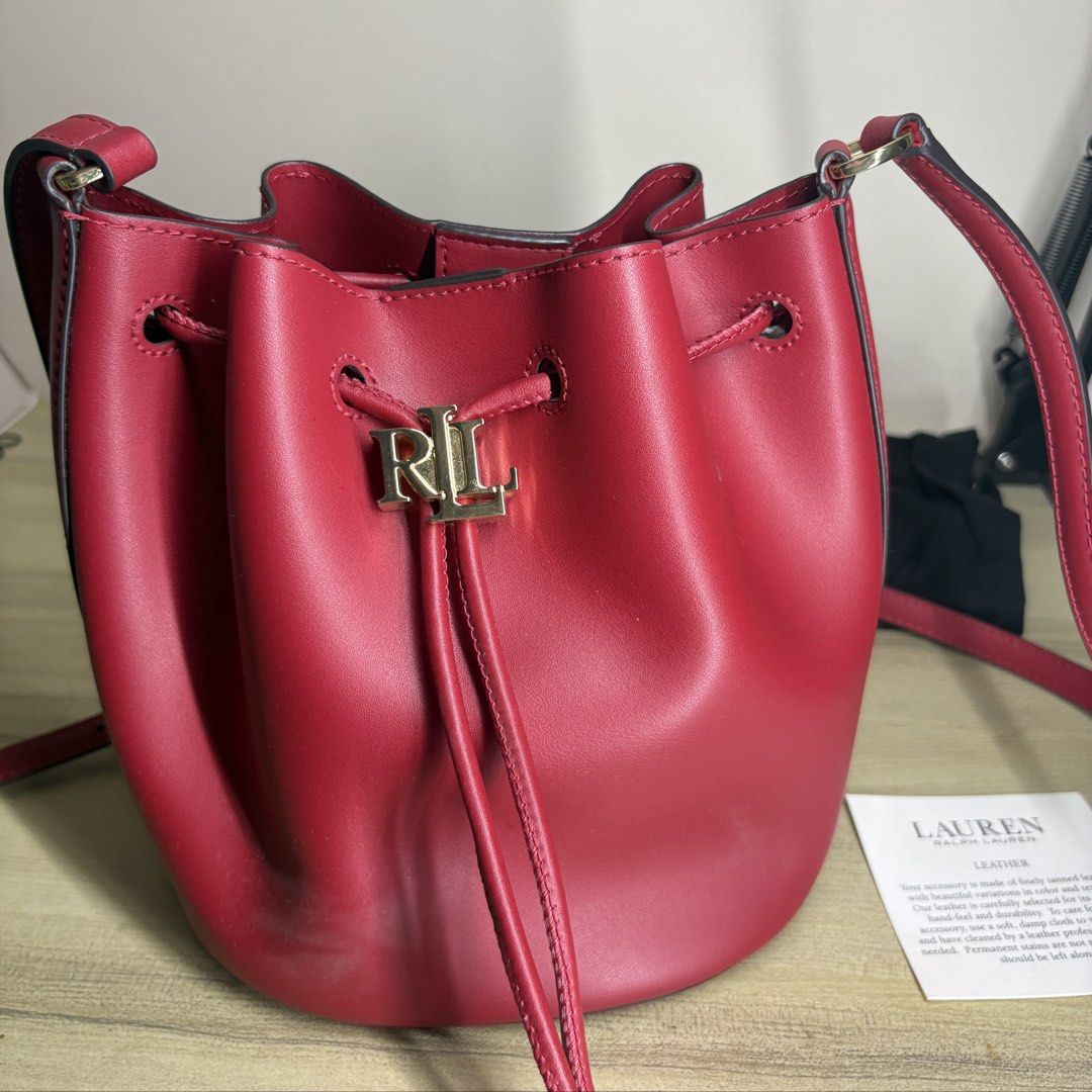 Ralph Lauren Red Leather Bucket Bag (Category: Luxury Bags & Wallets) located in Angeles City. Submitted by muse_archive (Listing ID 1470050332, Image 1). Description: -Lauren by Ralph Lauren - Inclusions: Black dust bag and product care card -Guaranteed authentic! Bought from the Ralph Lauren store in the US. 🇺🇸 -once lang nagamit Original price: ₱11,000 Selling price: ₱5,500 .