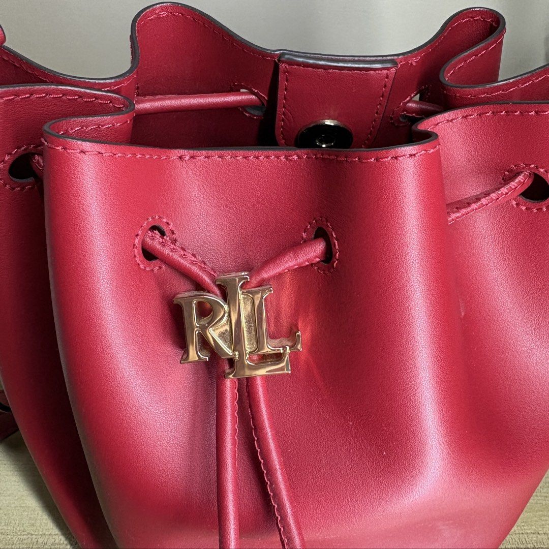 Ralph Lauren Red Leather Bucket Bag (Category: Luxury Bags & Wallets) located in Angeles City. Submitted by muse_archive (Listing ID 1470050332, Image 2). Description: -Lauren by Ralph Lauren - Inclusions: Black dust bag and product care card -Guaranteed authentic! Bought from the Ralph Lauren store in the US. 🇺🇸 -once lang nagamit Original price: ₱11,000 Selling price: ₱5,500 .