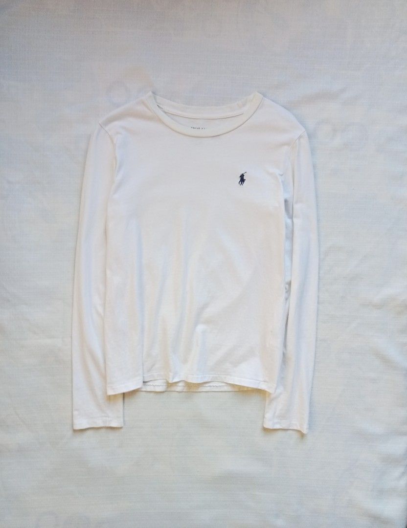 Ralph Lauren white longsleeve for her (Category: Longsleeves) located in Bagabag. Submitted by thrift_stories96 (Listing ID 1470099742, Image 1). Description: Ralph Lauren white longsleeve for her Small on tag fits medium Length - 24 Width - 18 Condition - 9/10 Normal sign of use by previous owner No major flaw.