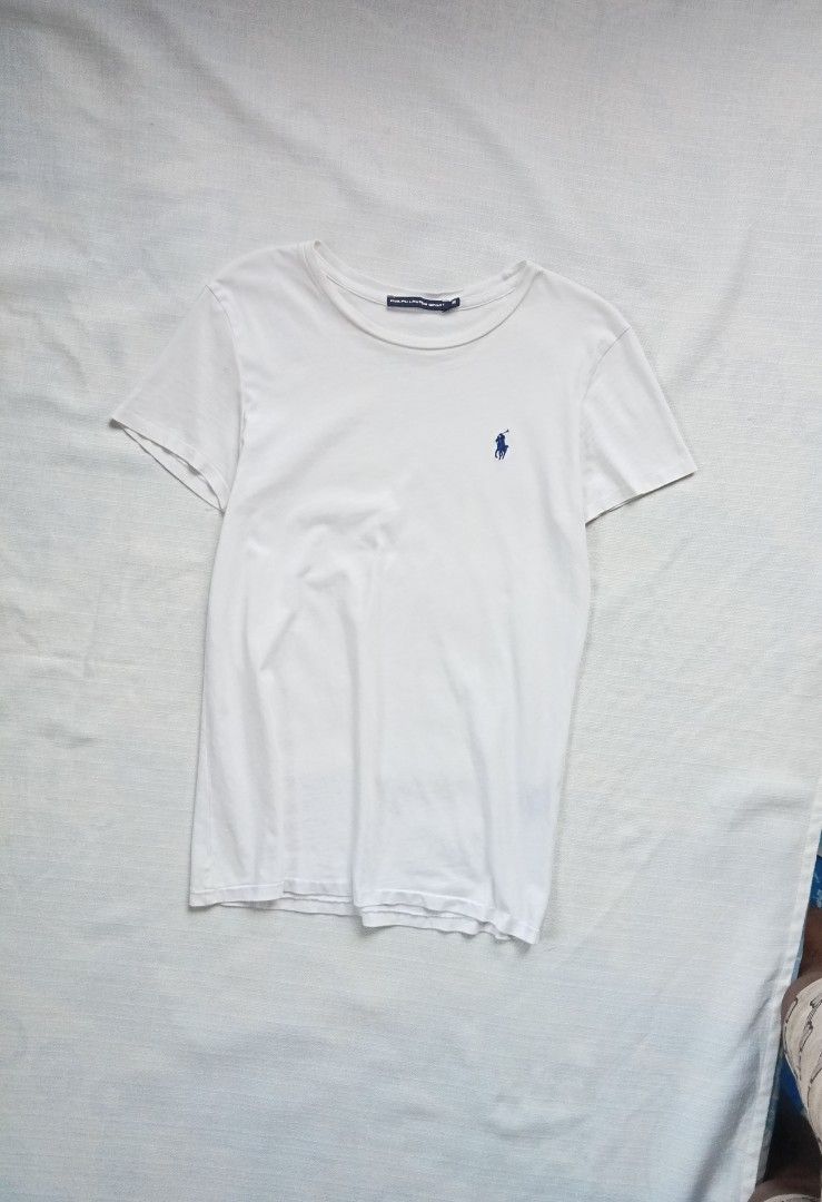 Ralph Lauren white roundneck tee for her (Category: Shirts) located in Bagabag. Submitted by thrift_stories96 (Listing ID 1470102718, Image 1). Description: Ralph Lauren white roundneck tee for her Small Length - 25 Width - 16.5 stretch up to 17 Condition - 8.5/10 Flaw - fade yellow stain on some parts,not noticeable when worn saka lang mapapansin pag titignan ng malapitan.Needs more washing.