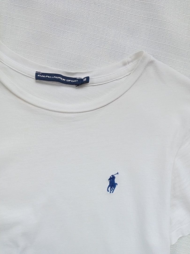 Ralph Lauren white roundneck tee for her (Category: Shirts) located in Bagabag. Submitted by thrift_stories96 (Listing ID 1470102718, Image 2). Description: Ralph Lauren white roundneck tee for her Small Length - 25 Width - 16.5 stretch up to 17 Condition - 8.5/10 Flaw - fade yellow stain on some parts,not noticeable when worn saka lang mapapansin pag titignan ng malapitan.Needs more washing.